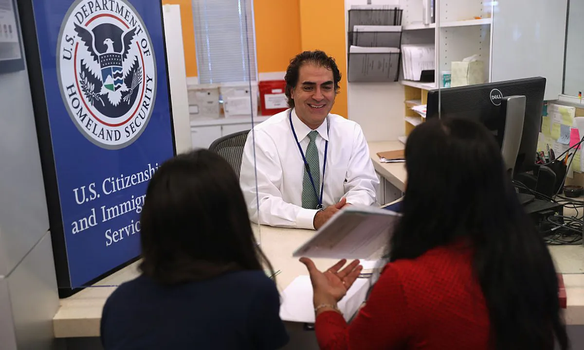 A U.S. Citizenship and Immigration Services (USCIS), officer interviews U.S citizenship applicants in the Dallas Field Office in Irving, Texas on August 22, 2016 . (John Moore/Getty Images)