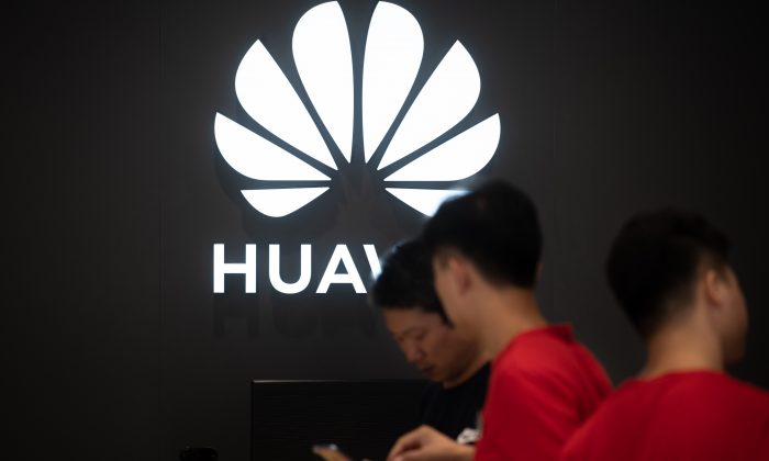 Employees work at a Huawei store in Dongguan, China, on Aug. 9, 2019. (Fred DufourAFP/Getty Images)