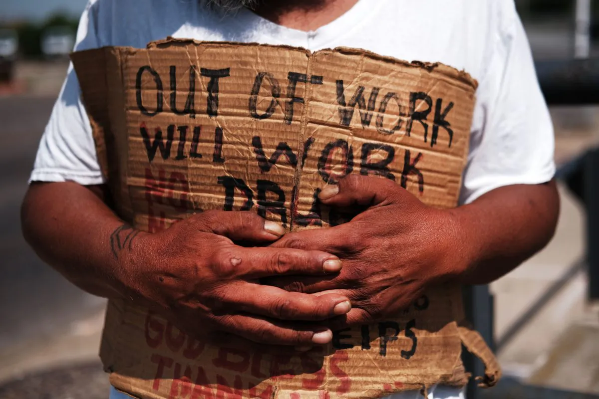 George, who is homeless, panhandles along a street in Lawrence on Aug. 16, 2019, in Lawrence, Massachusetts. Spencer Platt/Getty Images