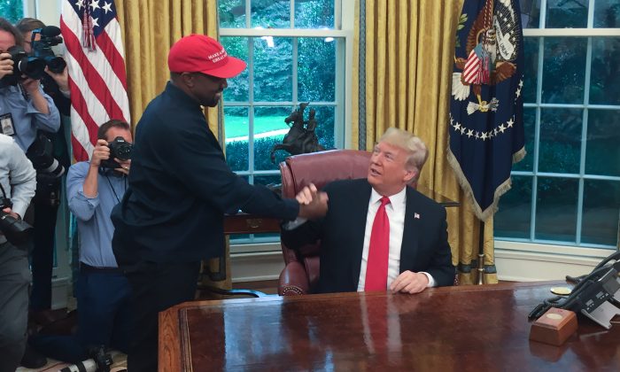 President Donald Trump meets with rapper Kanye West in the Oval Office of the White House in Washington on Oct. 11, 2018. (Sebastian Smith/AFP/Getty Images)