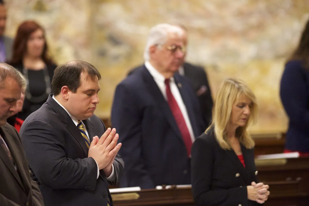 Electors pray before voting in the House of Representatives chamber of the Pennsylvania Capitol Building in Harrisburg, Pennsylvania, on Dec. 19, 2016. (Mark Makela/Getty Images)