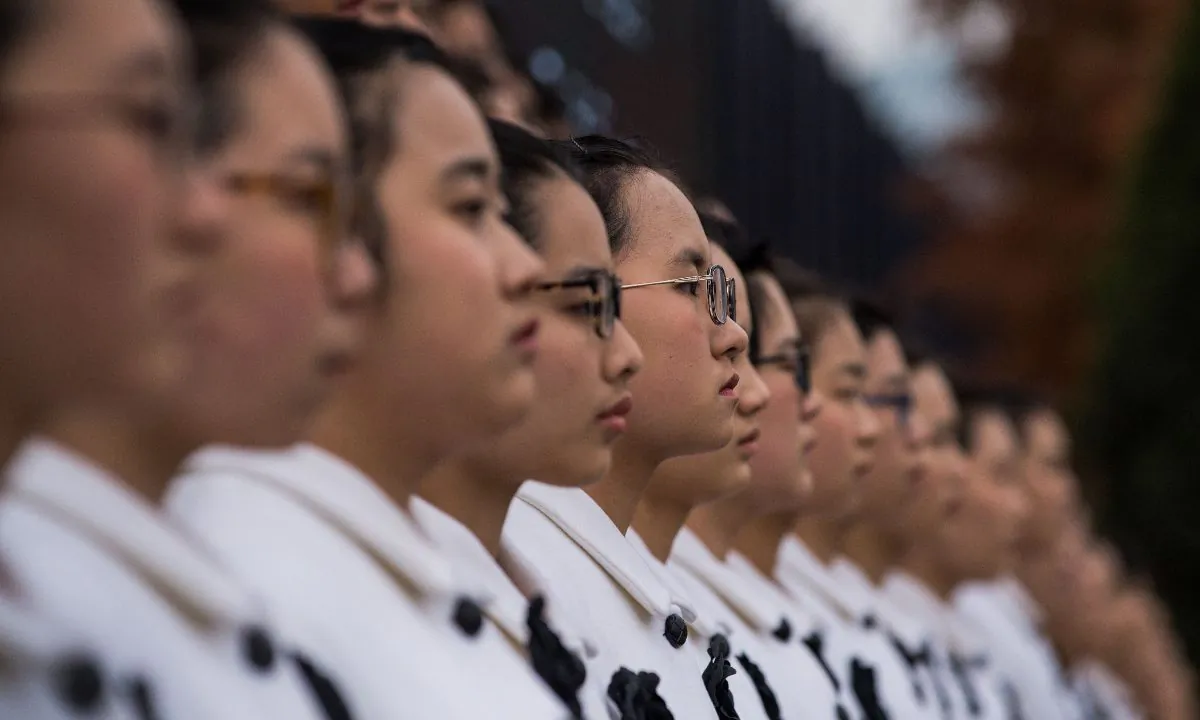 Chinese middle school girls in a choir performance. (Chandan Khanna/AFP/Getty Images)