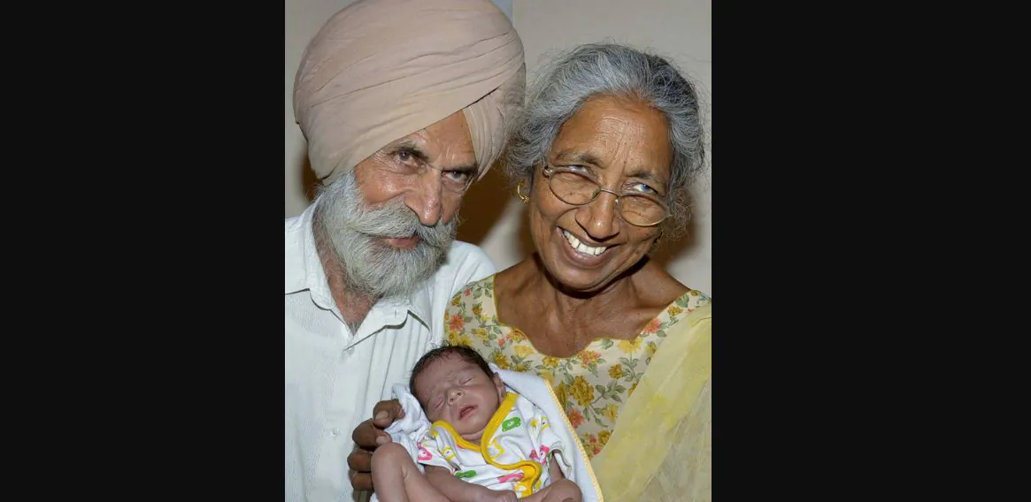 Daljinder Kaur and her husband, Mohinder Singh Gill, pose for a photograph with their newborn baby boy Arman at their home in Amritsar, India, on May 11, 2016. Kaur was was over 70 when she gave birth in April after two years of IVF treatment at a fertility clinic. (NARINDER NANU/AFP/GETTY IMAGES)