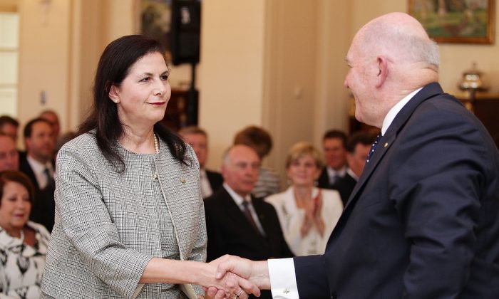 Concetta Fierravanti-Wells is congratulated by Governor-General Sir Peter Cosgrove in Canberra, Australia on Sept. 21, 2015. (Stefan Postles - Pool/Getty Images)