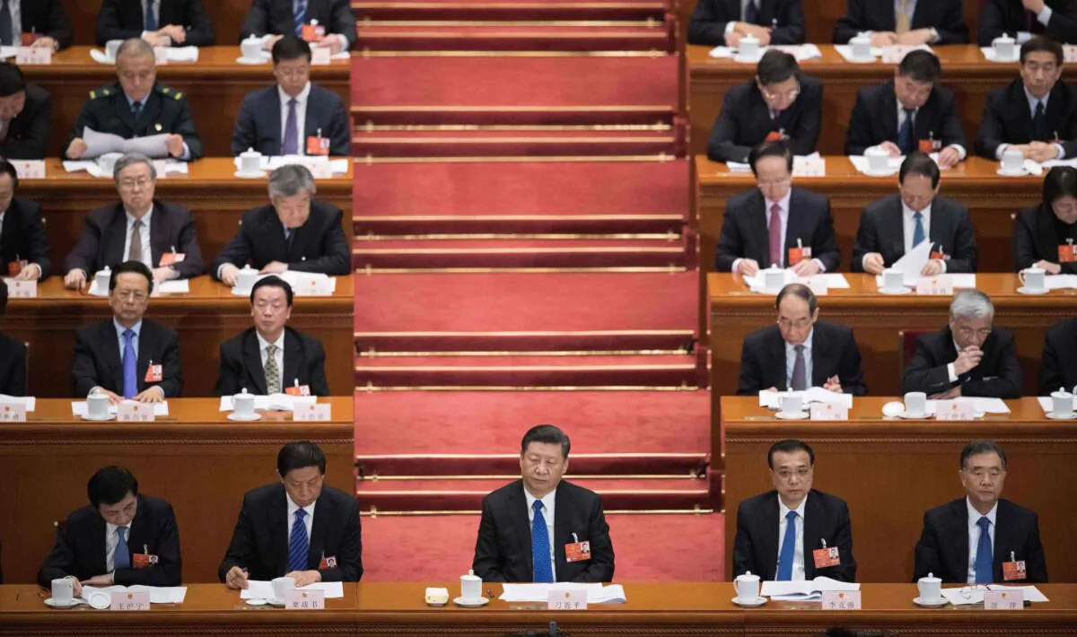 Chinese leader Xi Jinping (front C) attends the fourth plenary session of the Chinese Communist Party's rubber-stamp legislature, the National People's Congress, at the Great Hall of the People in Beijing on March 13, 2018. (NICOLAS ASFOURI/AFP/Getty Images)