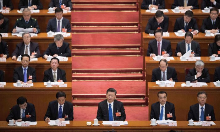 Chinese leader Xi Jinping (front C) attends the fourth plenary session of the Chinese Communist Party's rubber-stamp legislature, the National People's Congress, at the Great Hall of the People in Beijing on March 13, 2018. (NICOLAS ASFOURI/AFP/Getty Images)
