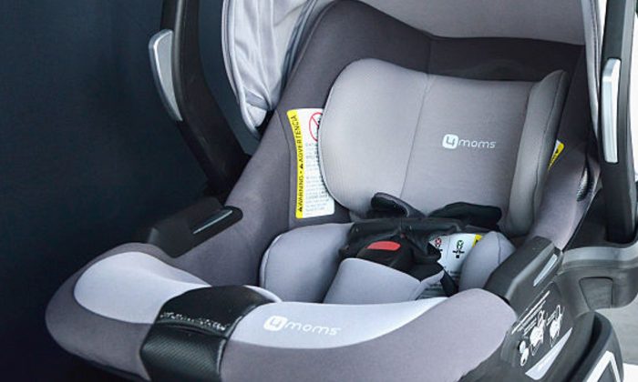 Image of a baby seat in a car. (Araya Diaz/Getty Images for 4moms)