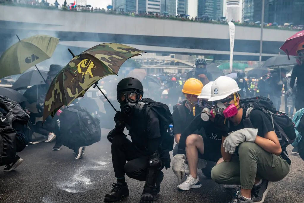 Protesters standoff with police in a cloud of tear gas during a clash outside of Central Government Complex in Hong Kong on Aug. 31, 2019. (Anthony Kwan/Getty Images)