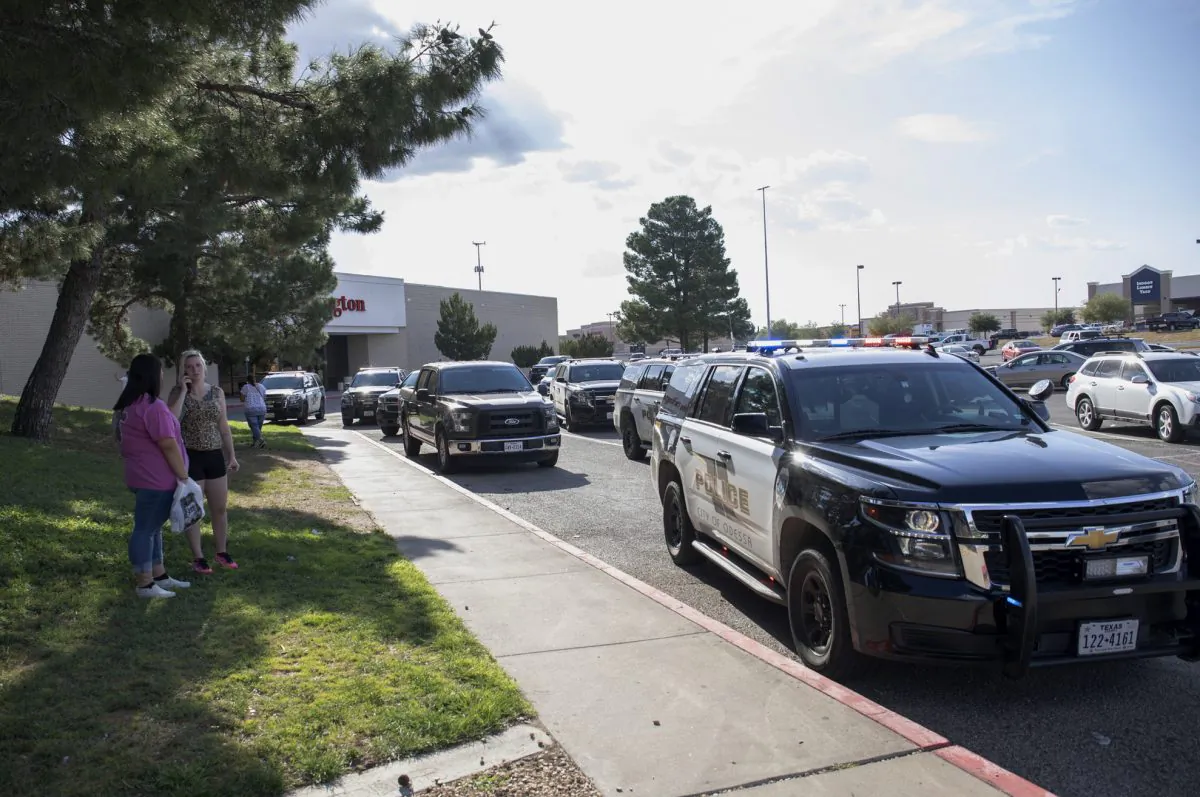 Odessa, Texas police officers park their vehicles outside Music City Mall. (Jacy Lewis/Reporter-Telegram via AP)