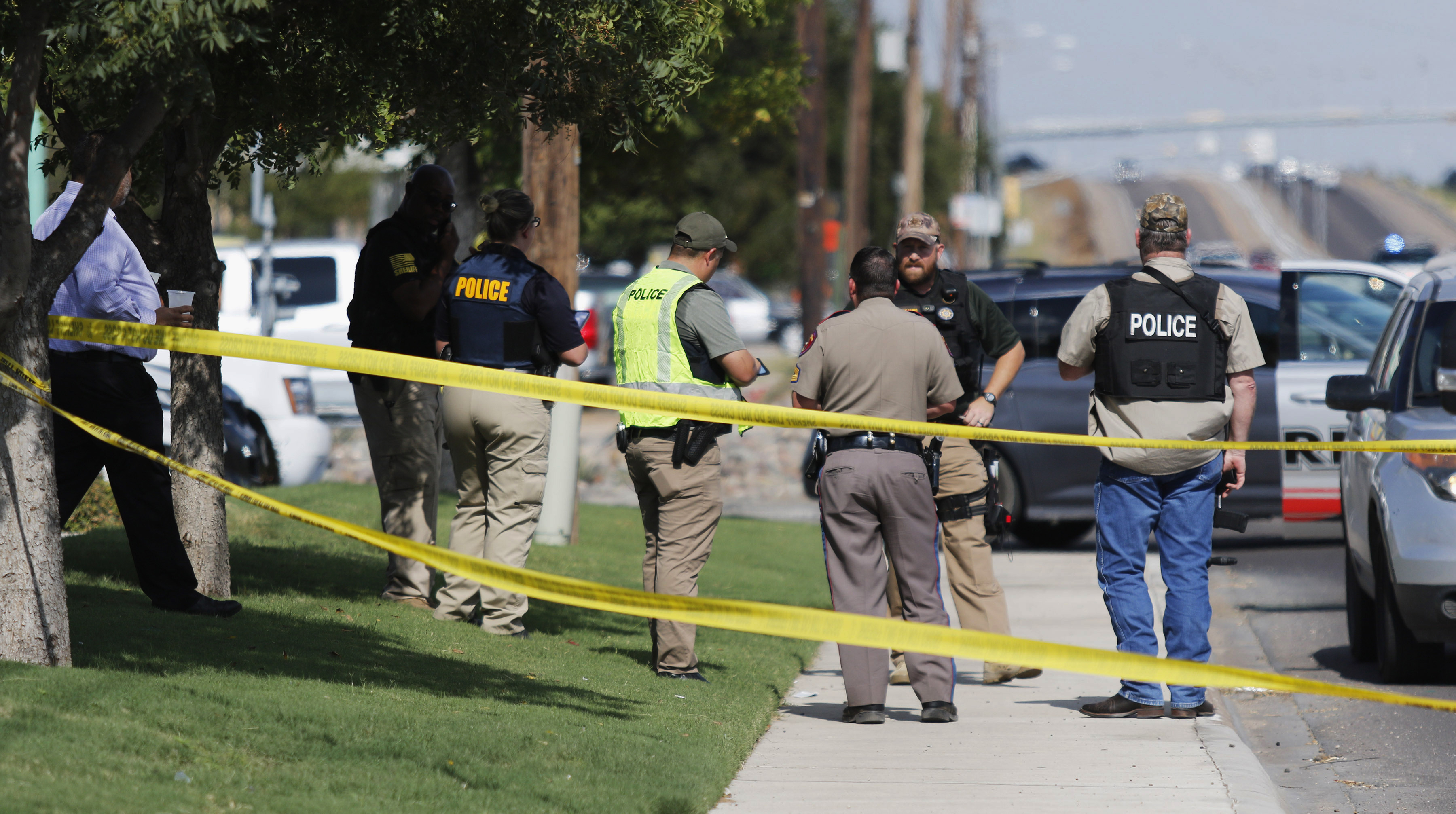 Authorities cordon off a part of the sidewalk