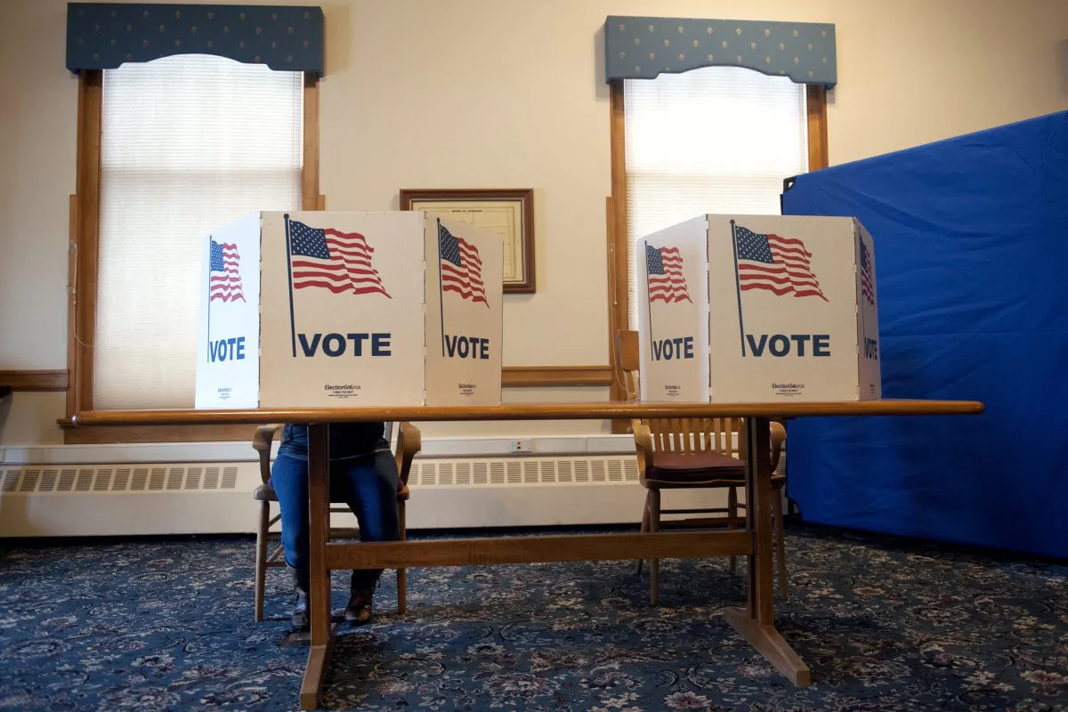 A lone voter casts her ballot at the Summit County Historic Courthouse in Breckenridge, Colorado on Nov. 6, 2018 (JASON CONNOLLY/AFP/Getty Images)