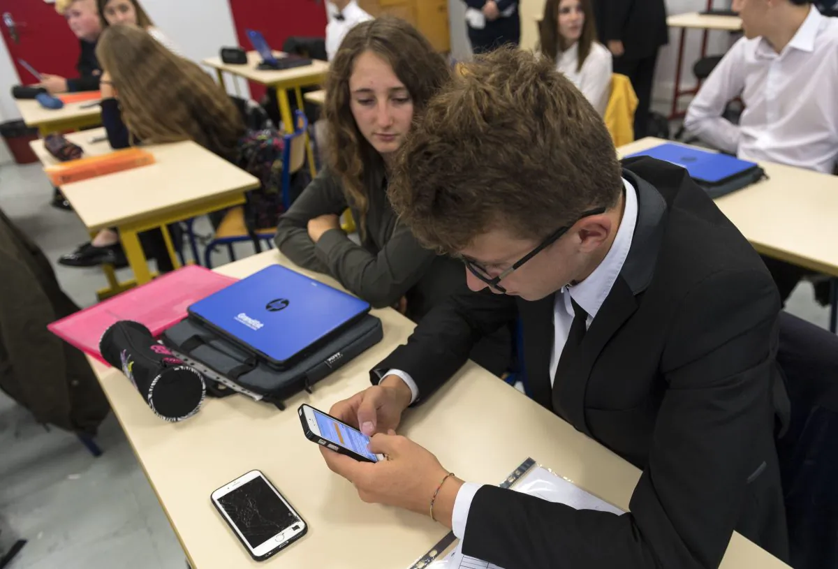 In this photograph taken on Sept. 26, 2017, high school students use smartphones and tablet computers at the vocational school in Bischwiller, eastern France.
Since the beginning of the school year in eastern France some 31,000 high school pupils have replaced their traditional textbooks by computers and tablets, a move popular with students but opinion is divided among teachers and parents. PATRICK HERTZOG/AFP/Getty Images