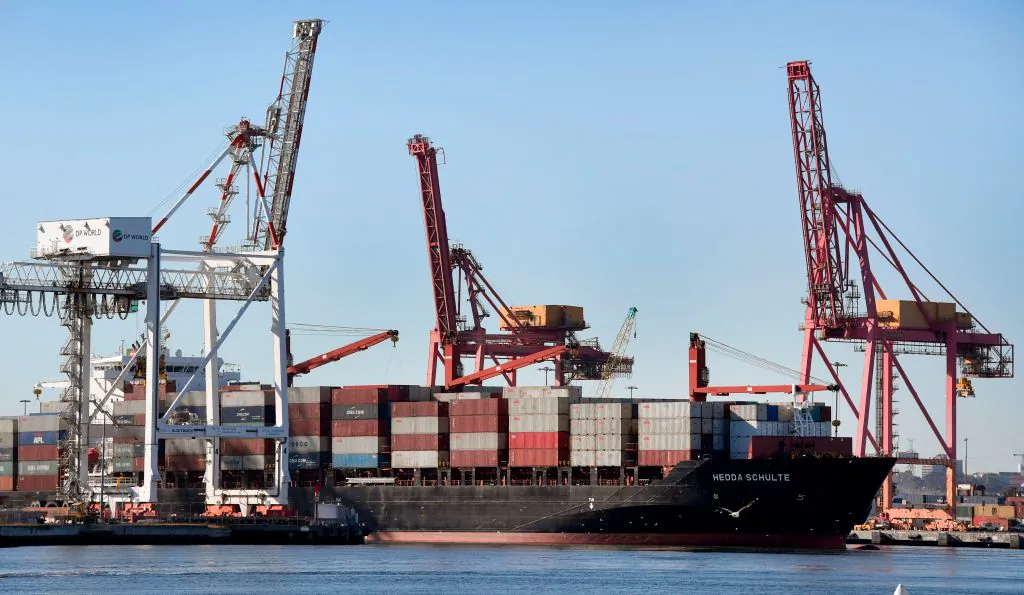 A container ship is pushed to it's berth by a tug at the Port of Melbourne on June 6, 2018. (William West/AFP/Getty Images)