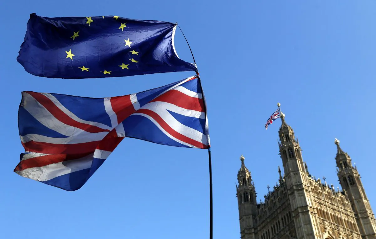 The flag of the European Union and the British national flags are flown on poles during a demonstration by remain in the EU outside spporters the Palace of Westminster in London on Feb. 27, 2019. (Alastair Grant/AP Photo)