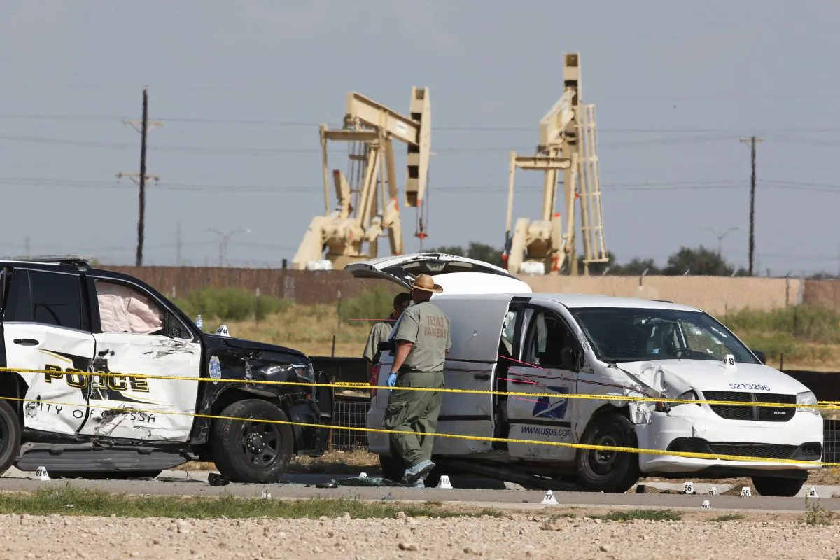 Law enforcement officials process the crime scene on Sept. 1, 2019, in Odessa, Texas, from Saturday's shooting which ended with the alleged shooter being shot dead by police in a stolen mail van, right. (Sue Ogrocki/AP)