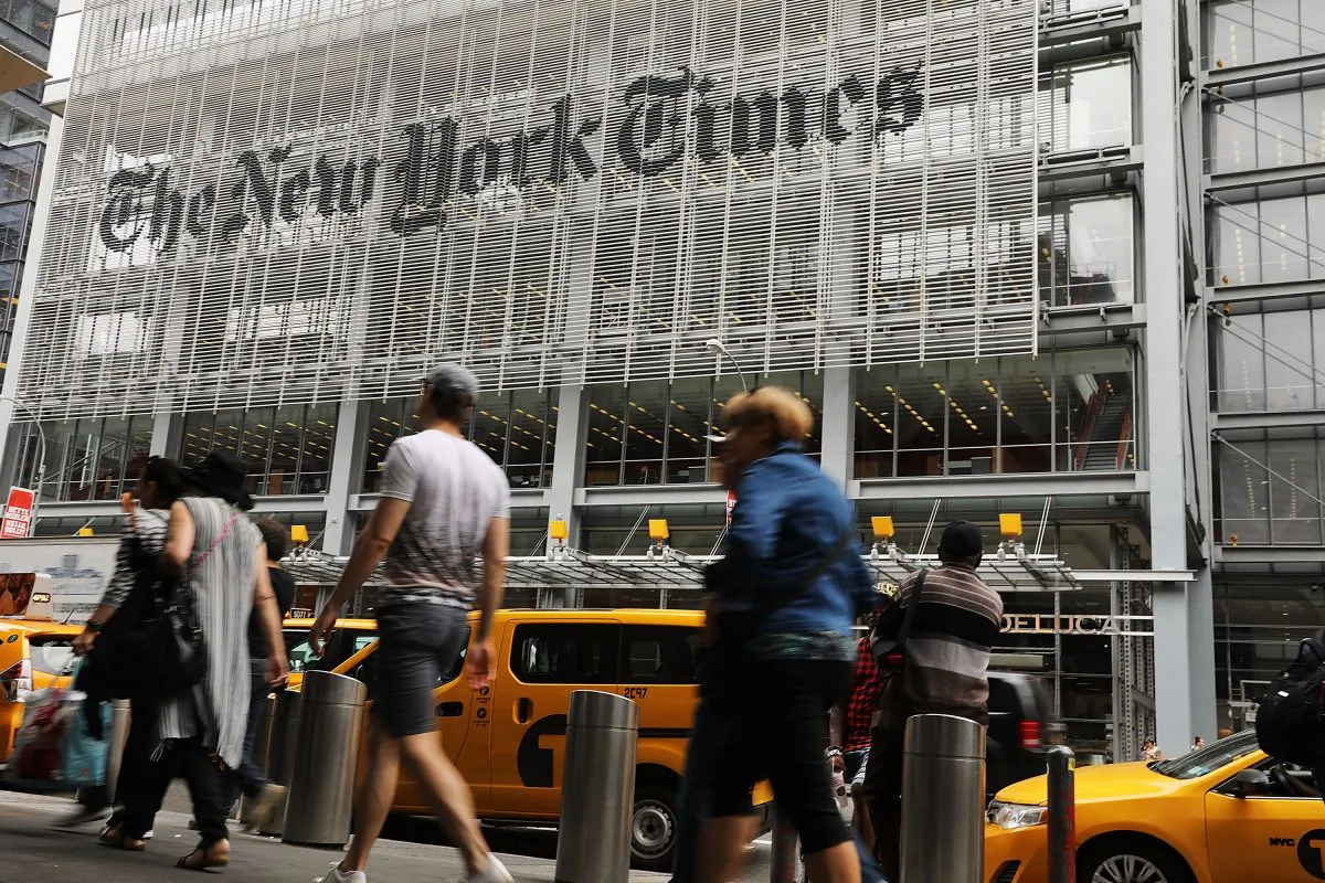 People walk past the New York Times building in New York City in a file photograph. (Spencer Platt/Getty Images)