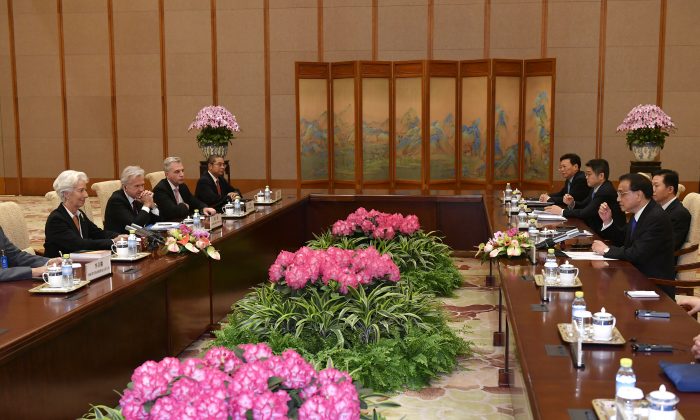 International Monetary Fund (IMF) Managing Director Christine Lagarde (L) attends a meeting with Chinese Premier Li Keqiang (R) at the Diaoyutai State Guesthouse in Beijing on April 24, 2019. (Parker Song/Pool/AFP/Getty Images)