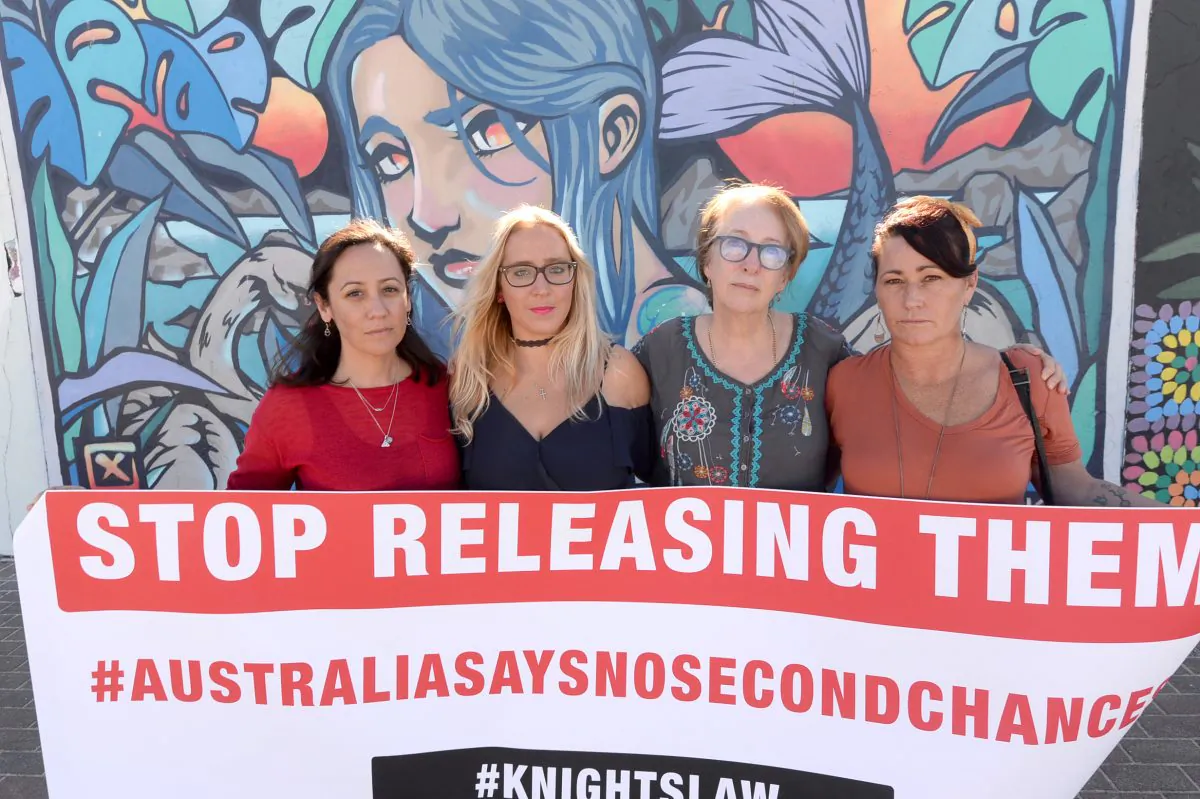 (L-R) Natalie Churnin, Chantelle Hamilton, Mother of Murdered Bondi schoolgirl Samantha Knight, Tess Knight and Tara Catsanis are seen during a community rally against the release of convicted paedophile and child murderer, Michael Guider, in Bondi, Sydney, on May 25, 2019. (AAP Image/Jeremy Piper)