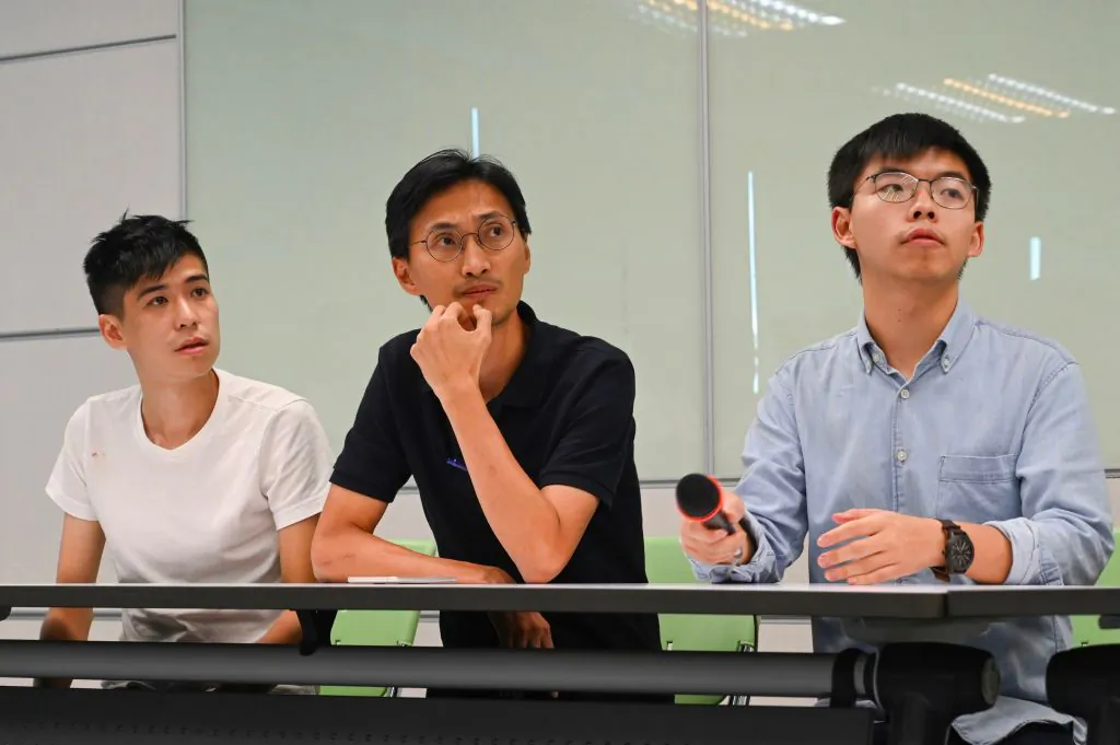 (L-R) Hong Kong pro-democracy activist Lester Shum, Hong Kong lawmaker Eddie Chu, and Secretary-General of Demosistō Joshua Wong attend a press conference at the headquarters of Taiwan's ruling Democratic Progressive Party (DPP) in Taipei on Sept. 3, 2019.  (Sam Yeh/AFP/Getty Images) 