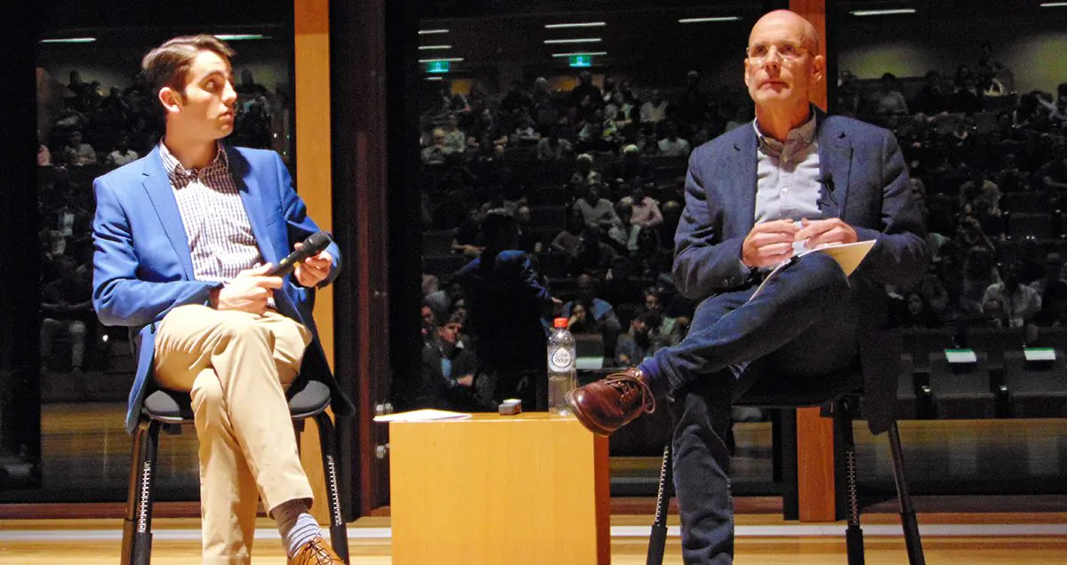 Charles Sturt University ethics professor Clive Hamilton (R) speaks at the University of Queensland in Brisbane, Australia, on Aug. 28, 2019. (Richard Szabo/The Epoch Times)