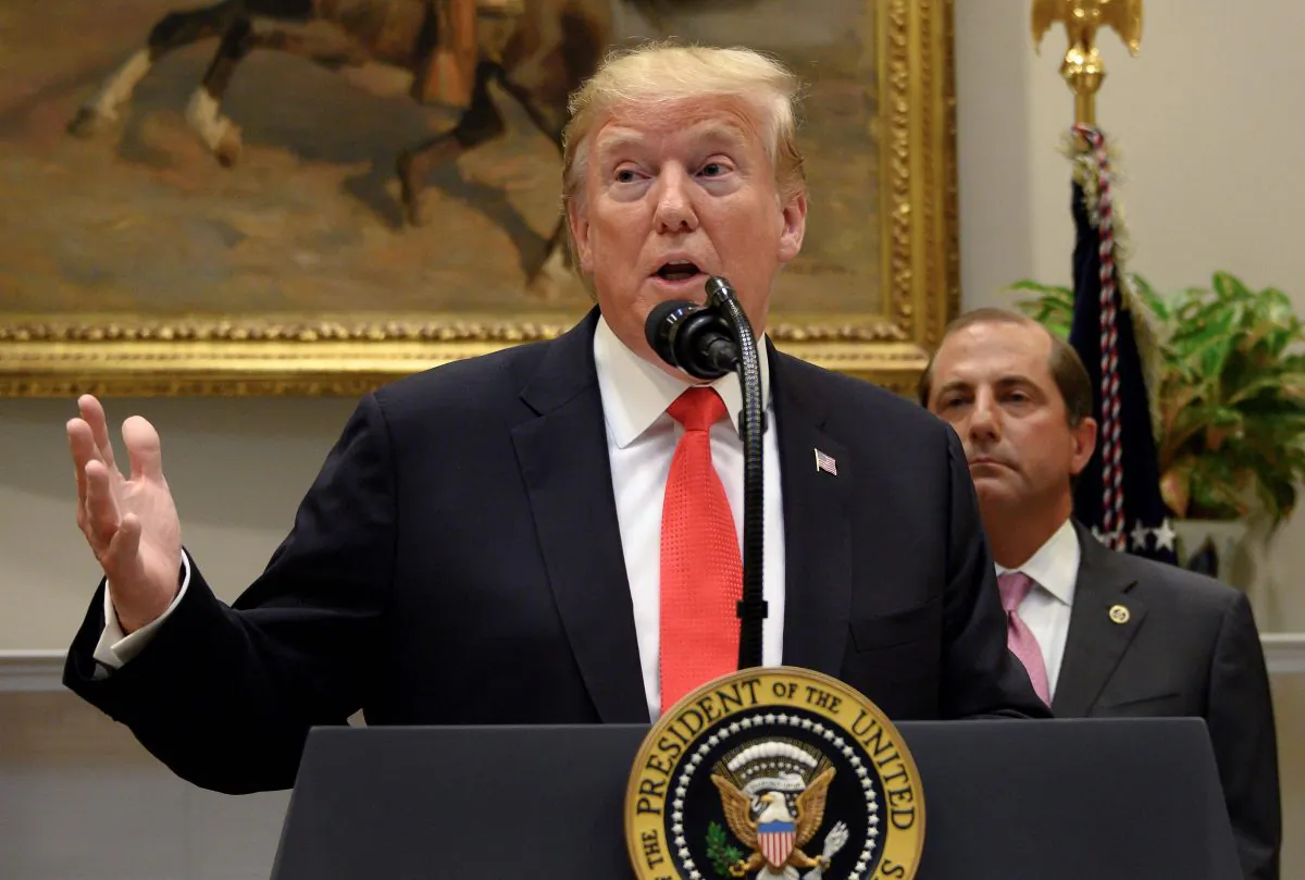 President Donald Trump and Secretary of Health and Human Services Alex Azar (R) gives brief remarks on the Administration's actions to combat the opioid crisis and announced $1.8B in grants to states and cities to assist in their responses to this crisis during an event at the White House on Sept. 4, 2019. (Jim Watson/AFP/Getty Images)