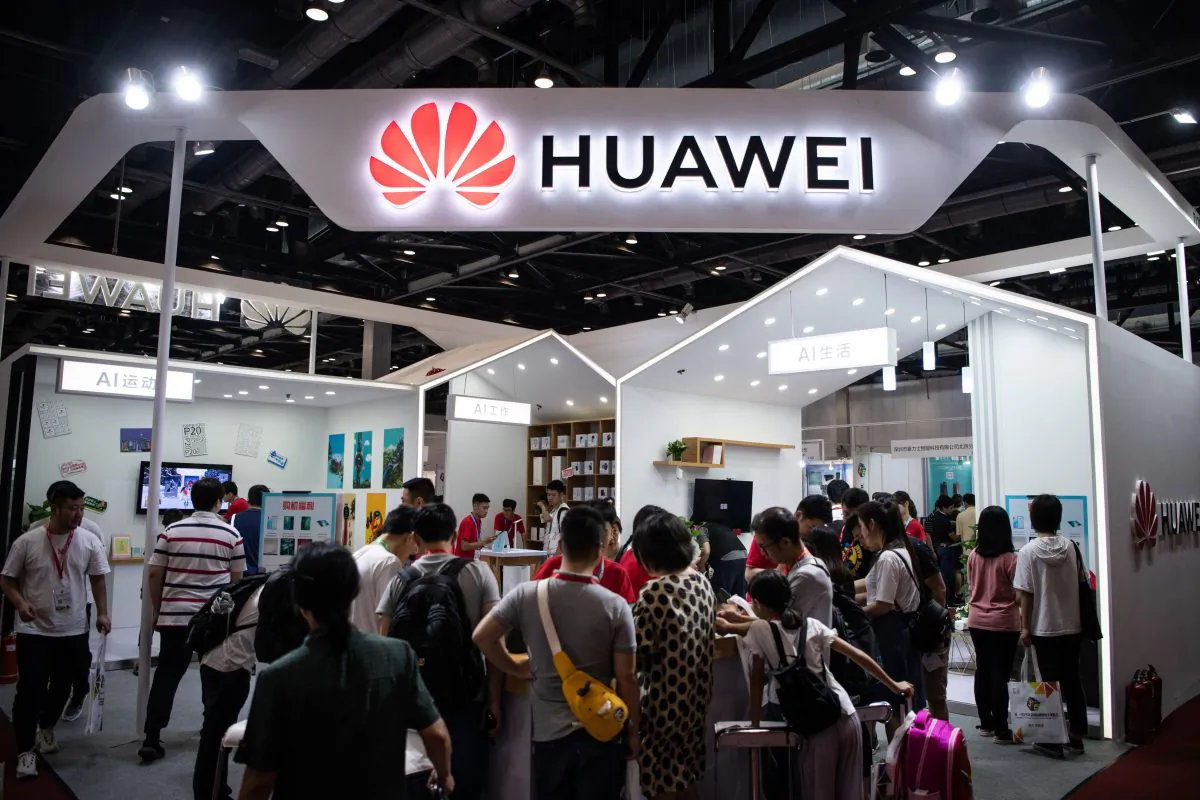 Attendees visit a Huawei exhibition stand during the Consumer Electronics Expo in Beijing, China on Aug. 2, 2019. (Fred Dufour/AFP/Getty Images)