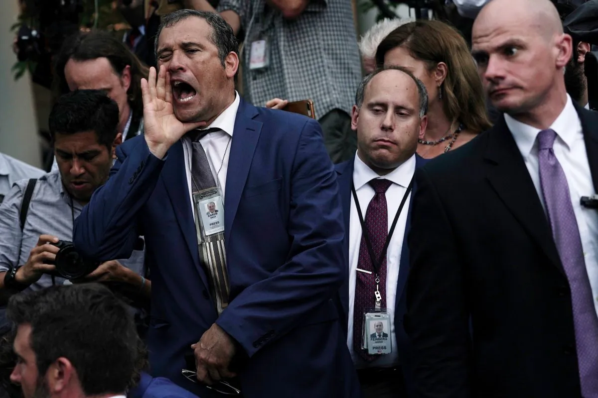 Brian Karem, a Playboy reporter, shouts at former aide to President Donald Trump, Sebastian Gorka, in the Rose Garden at the White House on July 11, 2019. (Photo by Alex Wong/Getty Images)