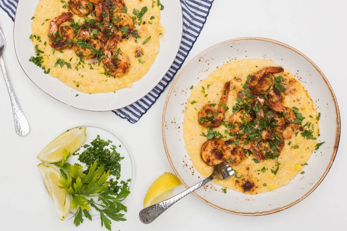 Cajun butter shrimp and cheesy cheddar grits. (Caroline Chambers)