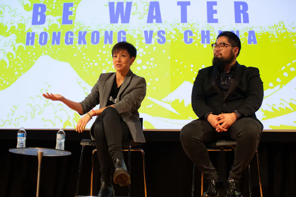 Cantopop star turned political activist Denise Ho Wan-see, also known as HOCC (left), and Chinese political cartoonist Badiucao, during the "Be Water: Hong Kong v China" event at Melbourne City conference centre  in Melbourne, Australia on Sept. 4, 2019. The event was held to discuss the current crisis in Hong Kong and the future of the city. (Asanka Ratnayake/Getty Images)