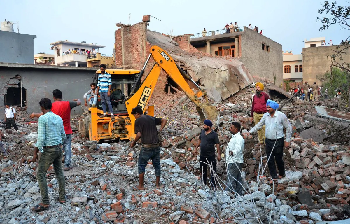 Rescue workers search for survivors after a blast at a firecrackers factory in Gurdaspur, India on Sept. 4, 2019. (Stringer/Reuters)