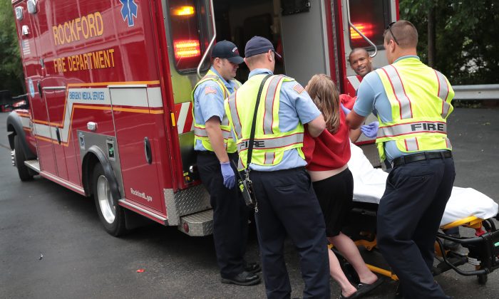 Firefighters help an overdose victim in Rockford, Illinois, on July 14, 2017. (Scott Olson/Getty Images)