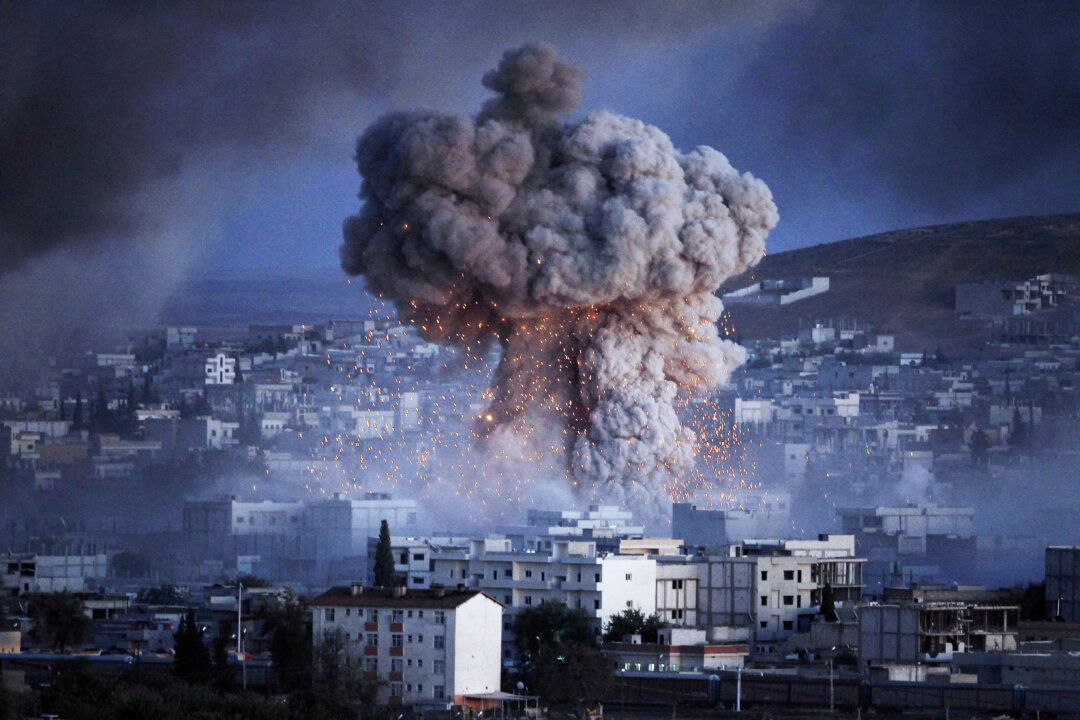 A file photo showing an explosion in the Syrian city of Kobani during a reported suicide car bomb attack by the ISIS terrorists on Oct. 20, 2014. (Gokhan Sahin/Getty Images)