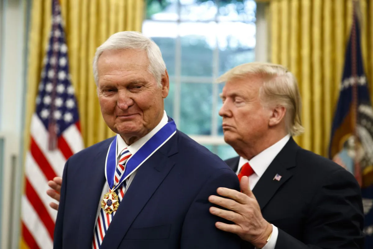 President Donald Trump (R) presents the Presidential Medal of Freedom to former NBA basketball player and general manager Jerry West, in the Oval Office of the White House on Sept. 5, 2019. (Alex Brandon/AP Photo)