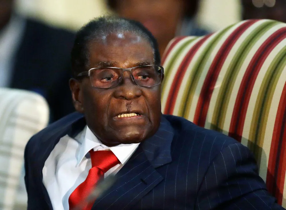 In this Oct. 3, 2017 file photo, then Zimbabwean President Robert Mugabe speaks during a meeting with South African President Jacob Zuma at the Presidential Guesthouse in Pretoria, South Africa. (AP Photo/Themba Hadebe, FILE)