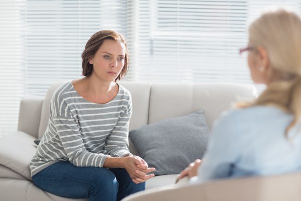woman talking to therapist