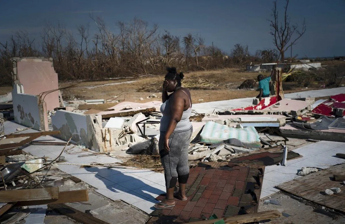 A woman is overcome as she looks at her house destroyed by Hurricane Dorian, in High Rock, Grand Bahama, Bahamas, on Sept. 6, 2019. (Ramon Espinosa/AP Photo)
