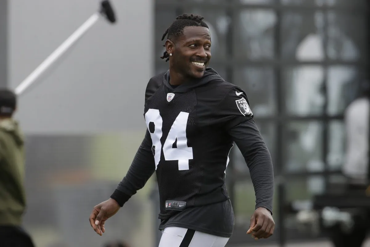 Oakland Raiders' Antonio Brown smiles before stretching during NFL football practice in Alameda, Calif., on Aug. 20, 2019. (Jeff Chiu/AP Photo)
