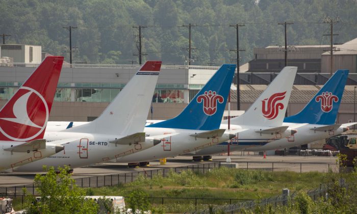 The tails of Boeing 737 MAX airplanes are seen as they sit parked at a Boeing facility adjacent to King County International Airport, known as Boeing Field in Seattle, Washington, on May 31, 2019. (David Ryder/Getty Images)