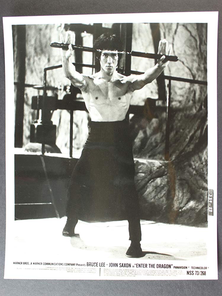 Bruce Lee with nunchucks