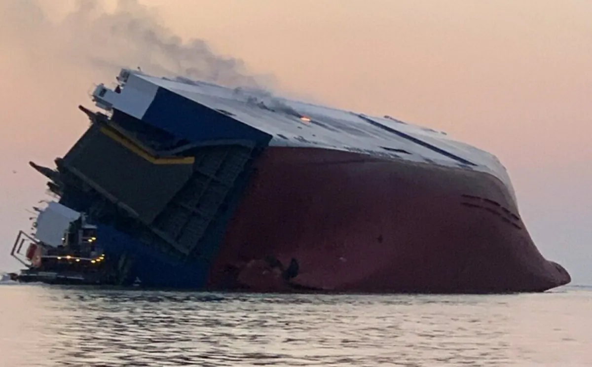Coast Guard crews and port partners respond to a disabled cargo vessel with a fire on board in St. Simons Sound, Ga., on Sept. 8, 2019. (U.S. Coast Guard via AP)