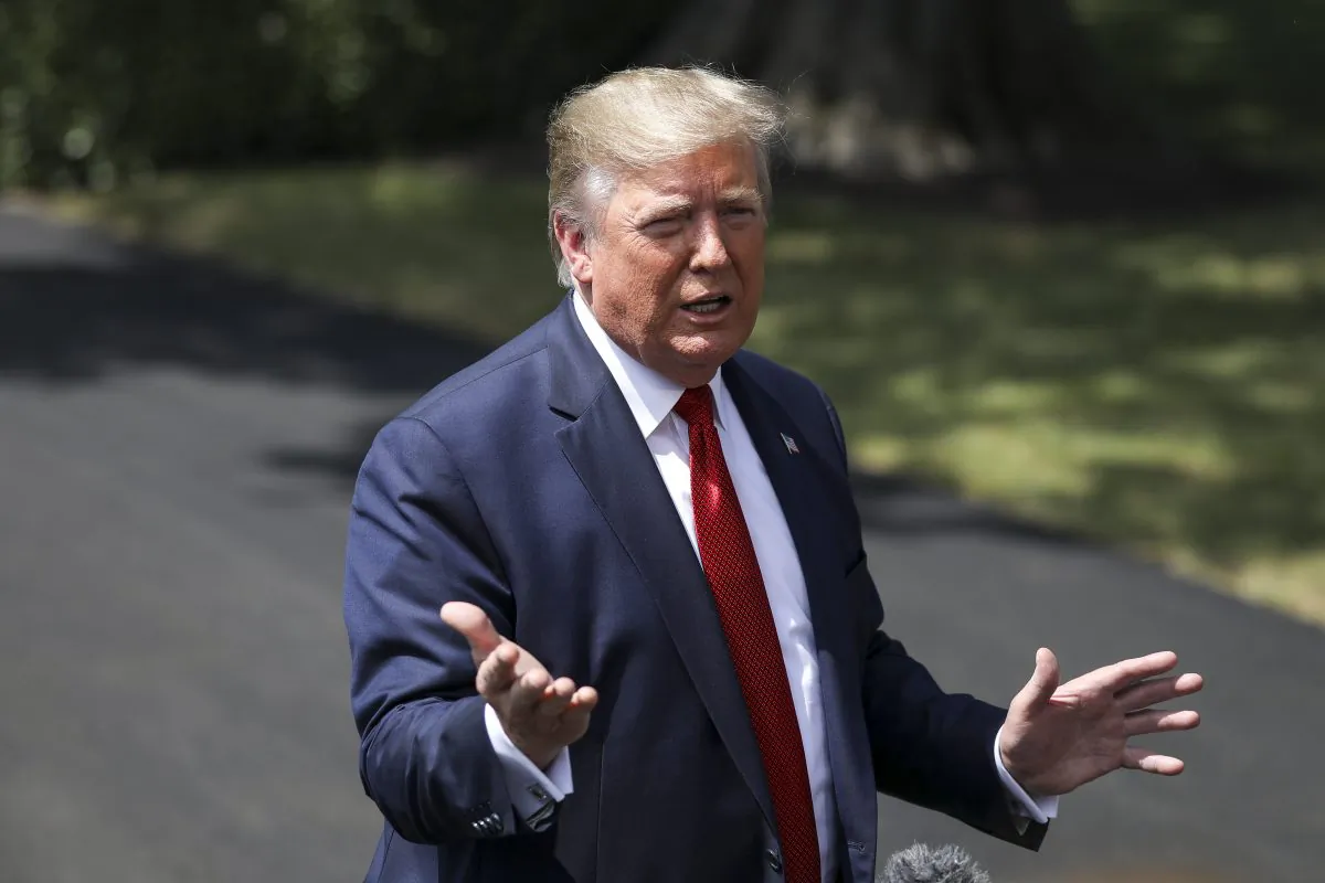 President Donald Trump speaks to media before departing the White House on Marine One en route to Kentucky to speak at the American Veterans 75th National Convention, in Washington in Aug. 21, 2019. (Charlotte Cuthbertson/The Epoch Times)