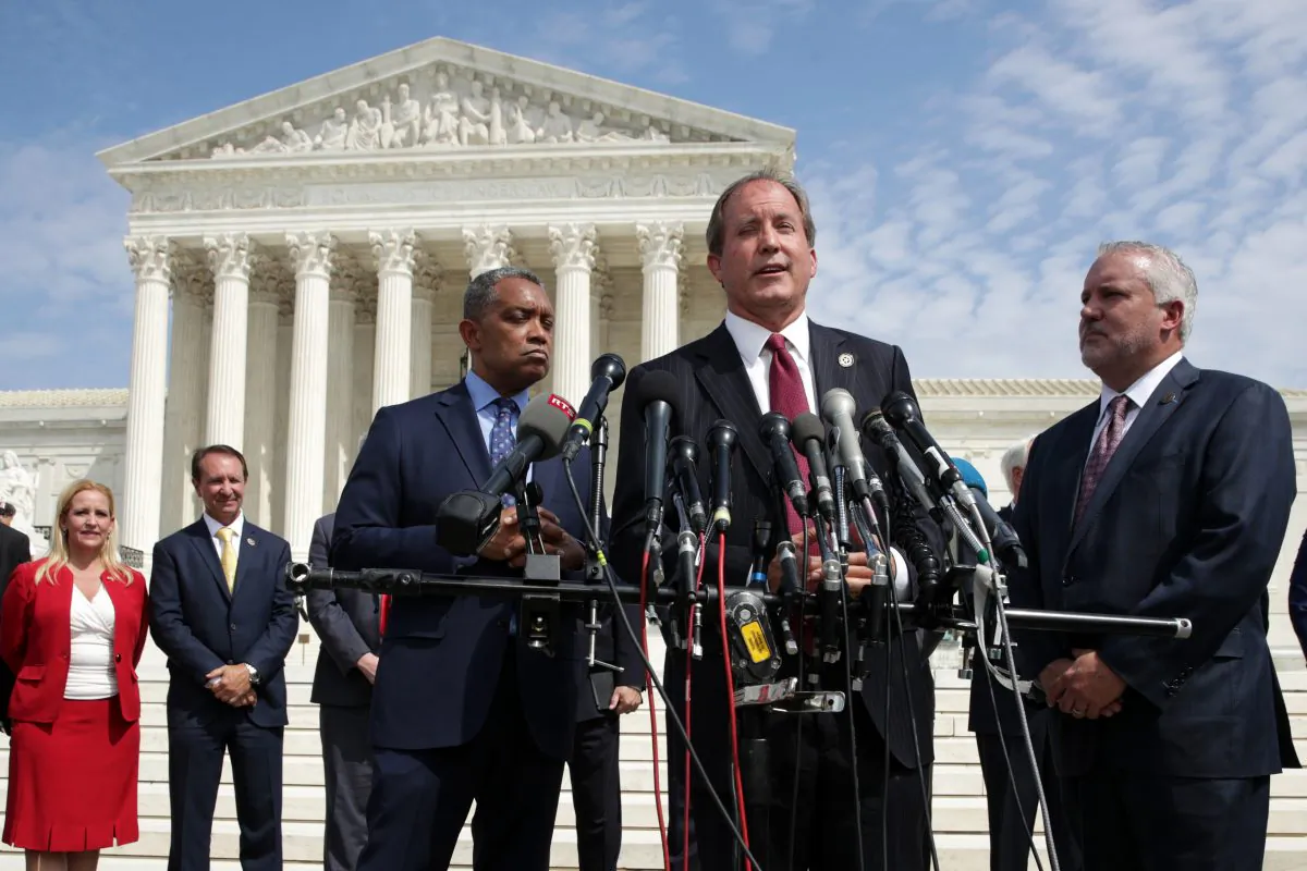Texas Attorney General Ken Paxton speaks as Washington Attorney General Karl Racine (L) listens during a news conference in front of the U.S. Supreme Court in Washington on Sept. 9, 2019. (Alex Wong/Getty Images)