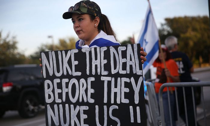 A woman protests against the nuclear deal reached with Iran before U.S. Vice President Joe Biden met with Jewish community leaders at the David Posnack Jewish Community Center to discuss the deal on Sept. 3, 2015 in Davie, Florida. (Joe Raedle/Getty Images)