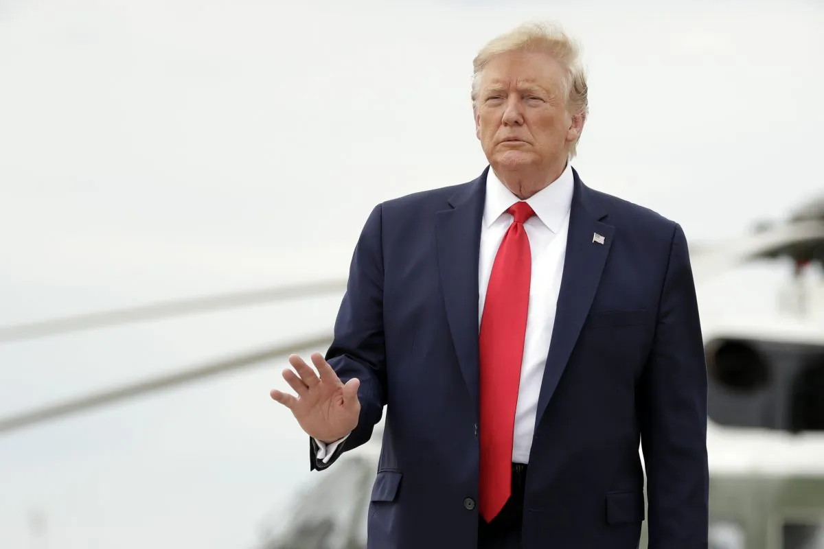 President Donald Trump boards Air Force One for a trip to North Carolina to survey hurricane damage and attend a campaign rally at Andrews Air Force Base, Md. on Sept. 9, 2019. (AP Photo/Evan Vucci)
