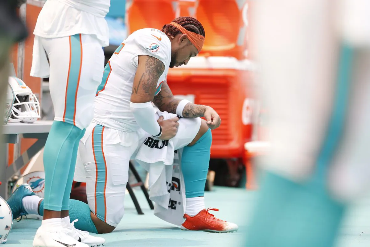 Albert Wilson #15 of the Miami Dolphins kneels during the playing of the national anthem prior to the game against the Baltimore Ravens at Hard Rock Stadium in Miami, Florida, on Sept. 8, 2019. (Michael Reaves/Getty Images)
