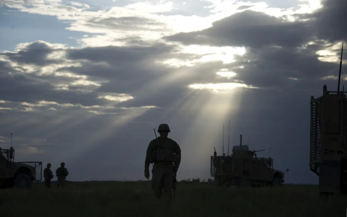 U.S. Ssg. Andrew Warner of the 2nd Platoon of Task Force 3-66, Bravo Company from the 172 Infantry Brigade walks to a Mine Resistant Ambush Protected (MRAP) vehicle in the village of Hasti in the province of Paktika on Sept. 3, 2011. Johannes Eisele/AFP/Getty Images