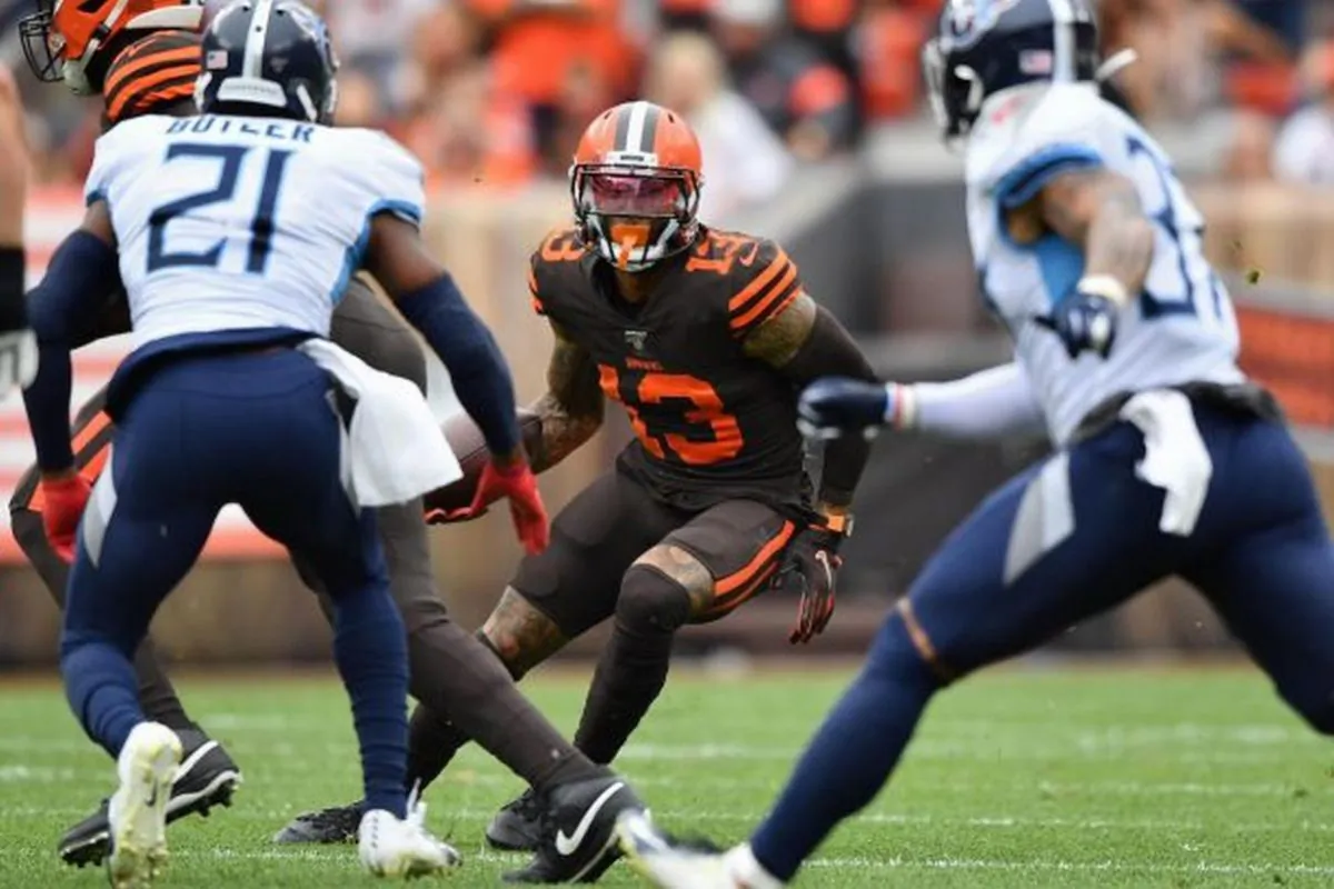 Odell Beckham Jr., #13, of the Cleveland Browns looks for running room after catching a pass in the second quarter against the Tennessee Titans at FirstEnergy Stadium in Cleveland, Ohio, on Sept. 8, 2019. (Jamie Sabau/Getty Images)