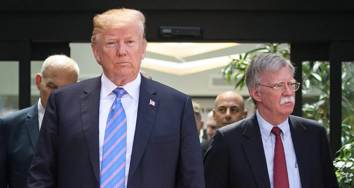 President Donald Trump (C) leaves with National Security Adviser John Bolton (R) after holding a press conference ahead of his early departure from the G-7 Summit in La Malbaie, Canada, on June 9, 2018. (Leon Neal/Getty Images)