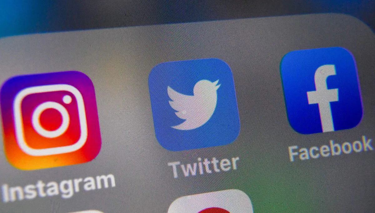 A picture taken on September 4, 2019 shows logos of US social networking websites Instagram, Twitter and Facebook, displayed on smart-phone screen, in Lille, northern France. DENIS CHARLET/AFP/Getty Images
