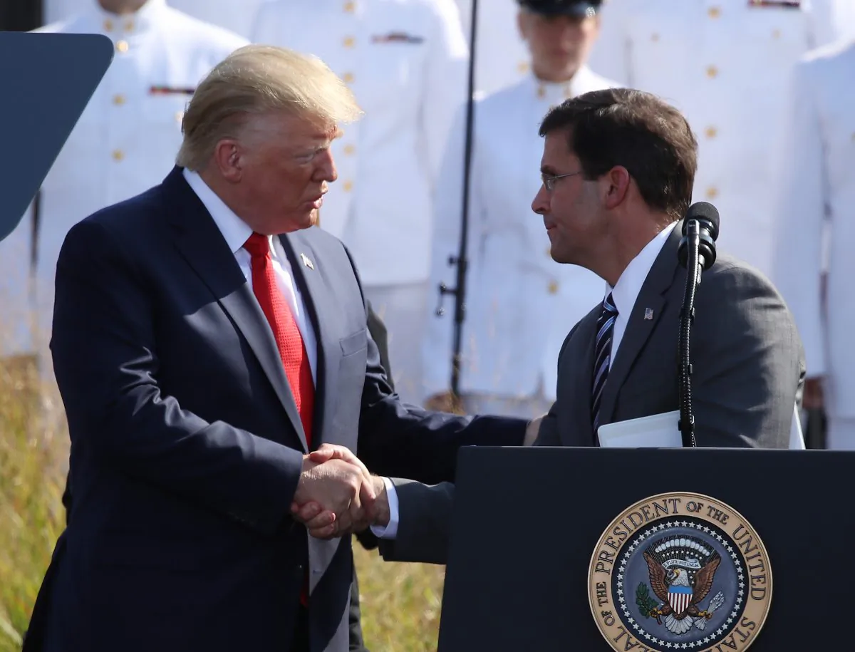 President Donald Trump (L), shakes hands with Secretary of Defense Mark Esper during a 9/11 memorial ceremony on Sept. 11, 2019. (Mark Wilson/Getty Images)